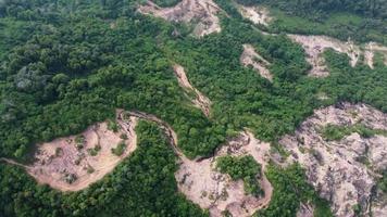 Aerial rotation view deforestation red clay soil mining quarry video