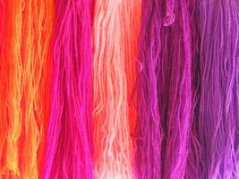 Yarn, several colors arranged abstract Gradient for background, Garn colorful pink orange red purple violet gold o-rose dark and soft color photo