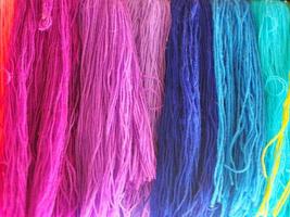 Yarn, several colors arranged abstract Gradient for background, Garn colorful pink orange red purple violet blue dark and soft color photo