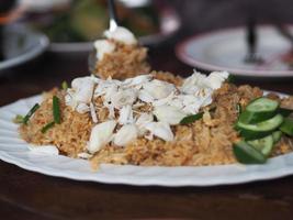 Crab meat fried rice on white plate, Thai food photo