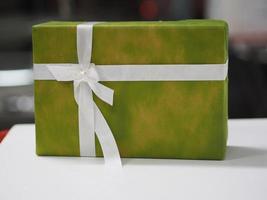 Stacked gift boxes wrapped in green colored paper, Festival Gifts for Christmas and Happy New Year photo