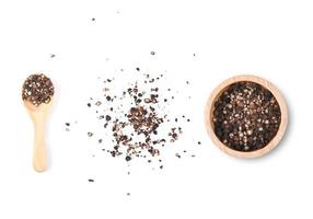 Ground black pepper isolated on a white background photo