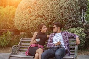 Young hipster couple teenagers in love in the city, Summer holiday enjoyment together. photo