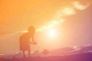 kid silhouette,Moments of the child's joy. On the Nature sunset photo