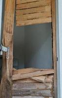 old wood door with termites damage photo