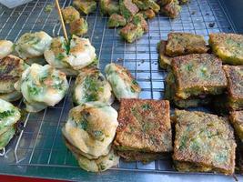 Fried Garlic chives cake are sale at the flea market. photo