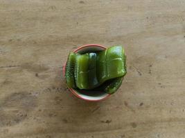 Layered sweet cake or thai call Khanom Chan Thai traditional dessert Green Pandan flavour in cup photo