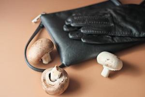 handbag and gloves made of mycelium leather, bio sustainable alternative to leather made of mushroom spores and plant fibres. mushroom textile innovative materials. eco bio-gradable vegan leather photo