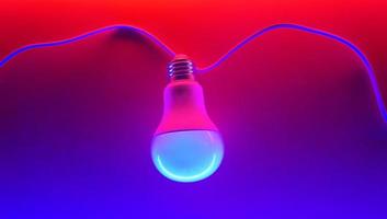 White light bulb on colored background in pastel colors. Minimalist concept, bright idea concept, isolated lamp photo