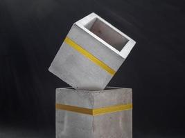 Modern cubic concrete planter. Painted concrete pot for home decoration photo