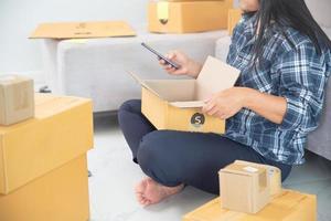 Women working freelance and packing box photo