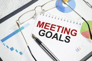 Notebook with Tools and Notes with text MEETING GOALS photo