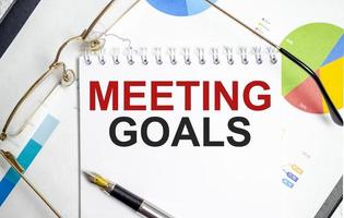 Notebook with Tools and Notes with text MEETING GOALS photo