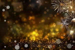 Abstract golden glitter and bokeh light background. with fireworks photo