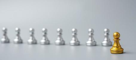 Gold Chess Pawn figure Stand out from the crowd on Chessboard background. Strategy, leadership, business, teamwork, different, Unique and Human resource management concept photo