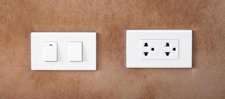 light switch on wall at home. Energy Saving, power, electrical and lifestyle concepts photo