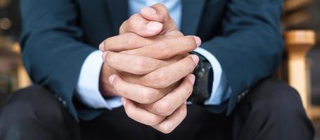 Businessman in suit at office or cafe, hand of man holding during something thinking. business, decision and vision concepts photo