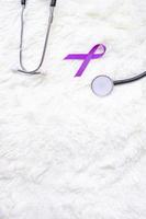 Pancreatic Cancer, world Alzheimer, epilepsy, lupus and domestic violence day Awareness month, Woman holding purple Ribbon with stethoscope. Healthcare and World cancer day concept photo