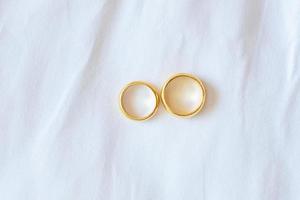 couple golden engagement ring on white background. Love, together and Happy Valentines day concept photo