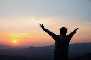 woman worship on sunset photo