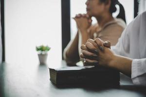 Two women praying worship believe photo