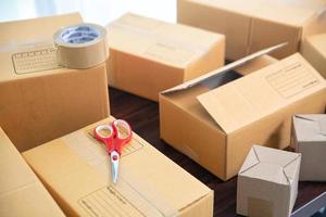 Cardboard parcel boxes on wooden table photo