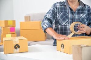 Women working freelance and packing box photo