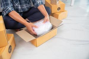 Women working freelance and packing box photo