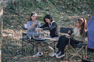 three bestie go camping in the forest photo