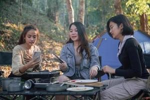 three bestie go camping in the forest photo