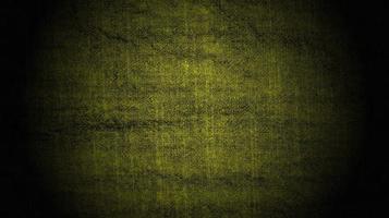 abstract yellow cloth background with black gradient texture. photo