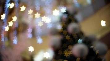 Blurry focus of star shape bokeh in led light background. video