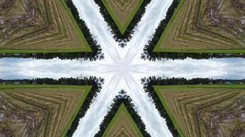 Kaleidoscopic harvested paddy field. Green natural abstract video