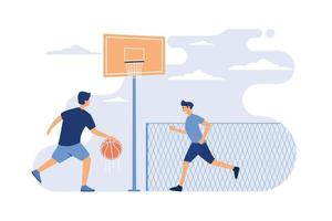 concepto de juegos deportivos al aire libre. dos jóvenes atléticos jugando baloncesto en un estadio urbano.