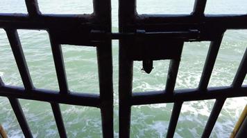 Llock of door at moving ferry at sea video