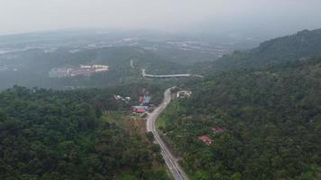 Aerial view main asphalt road cross plantation toward Balik Pulau video