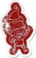 happy cartoon distressed sticker of a boy wearing santa hat vector