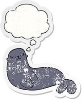 cute cartoon seal and thought bubble as a distressed worn sticker vector