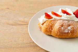 strawberry fresh cream croissant on plate photo