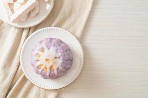 taro bun with white sugar cream and nut photo
