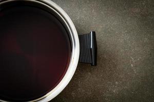 black soup in hot pot for shabu or sukiyaki photo