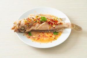 Steamed grouper fish with lime and chillies photo