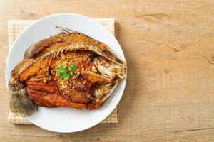 Fried Sea Bass Fish with Garlic photo