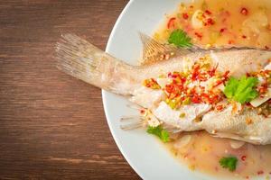 Steamed grouper fish with lime and chillies photo