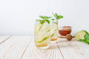 iced honey and lime soda with mint photo