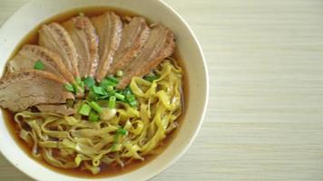 egg noodles with stewed duck in brown soup - Asian food style video