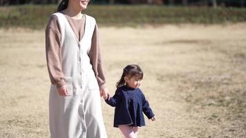 Parents and children walking hand in hand video