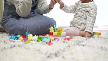 Parents and children playing with blocks video