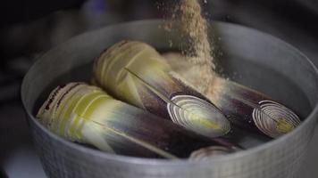 A woman boiling bamboo shoots video