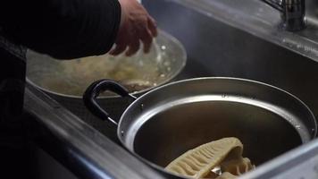 A woman flushing boiled bamboo shoots with water video